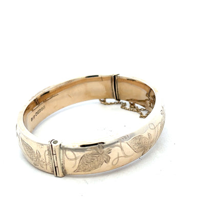 9ct yellow gold bangle bracelet weighing 20.3g, unbranded, with a smooth, polished finish, shown on a white background.