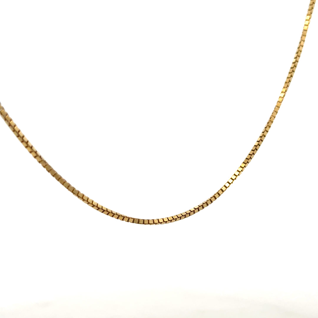 9ct yellow gold box chain, unbranded, 6.4g, close-up of the sleek chain with rectangular links on a plain background.