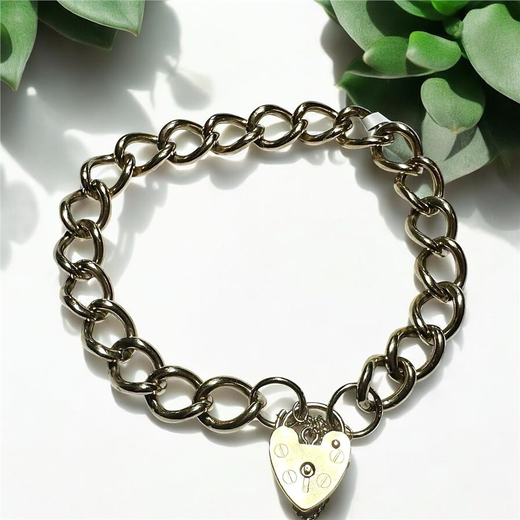 9ct yellow gold bracelet weighing 26.3 grams, unbranded jewelry accessory with a sleek, polished finish.