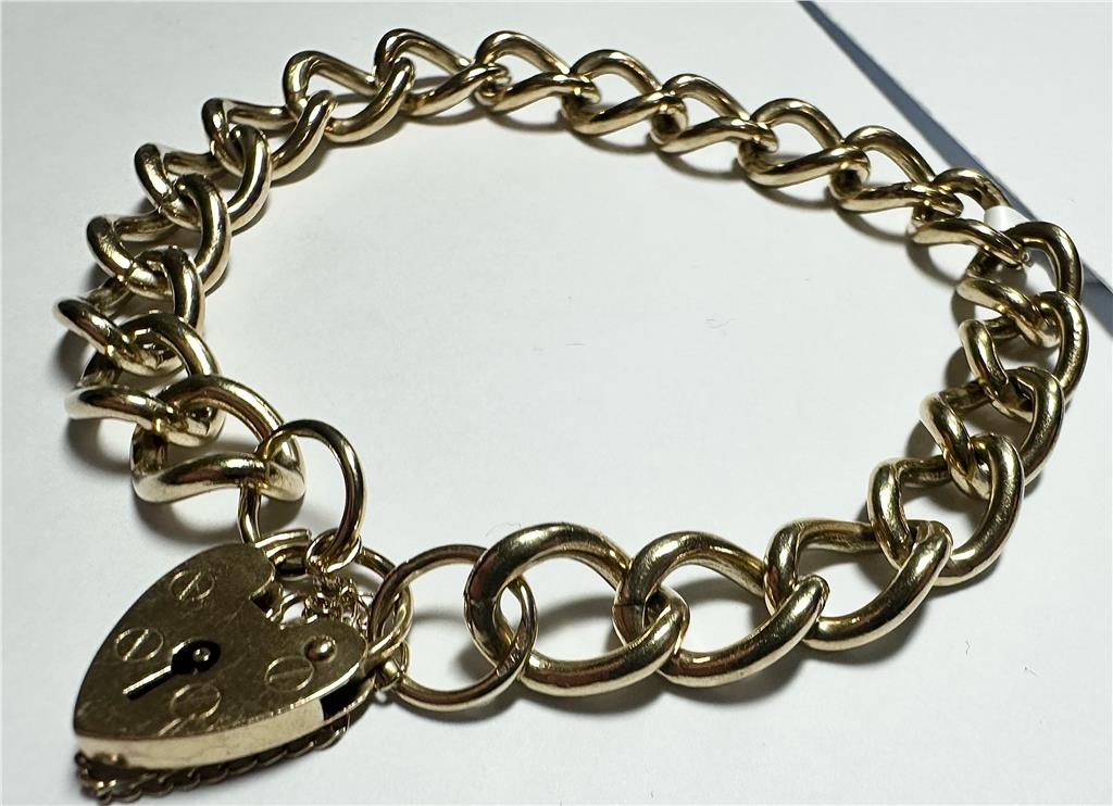 9ct yellow gold bracelet weighing 26.3g, unbranded jewelry with a sleek design, shown in a close-up image highlighting its shine.