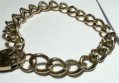 9ct yellow gold bracelet weighing 26.3g, unbranded jewelry piece with intricate design visible in the image.