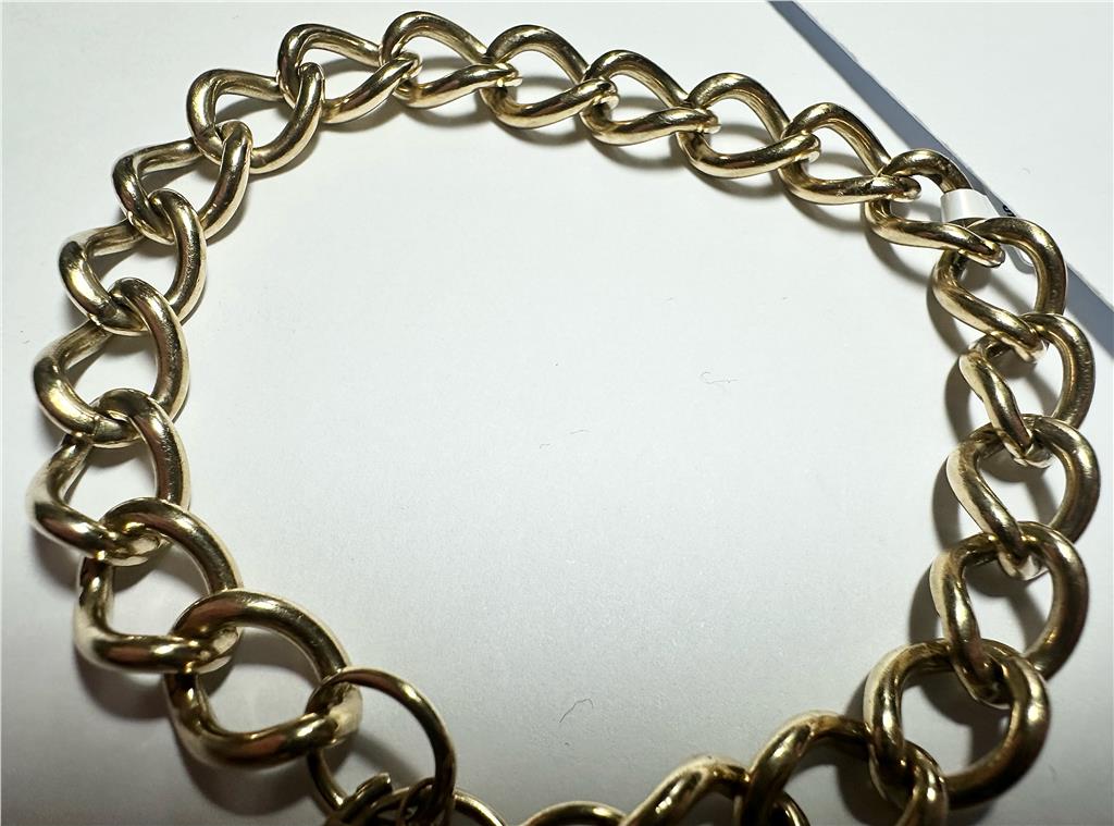 9ct yellow gold bracelet with 26.3 grams, featuring a sleek design and polished finish, perfect for elegant jewelry collection.