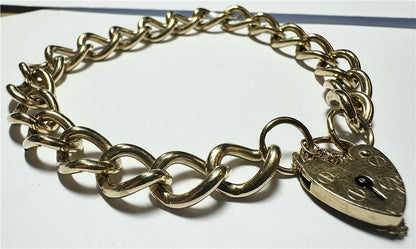 9ct yellow gold bracelet with a polished finish, weighing 26.3 grams, displayed on a neutral background.