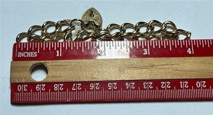 9ct yellow gold bracelet weighing 26.3g, unbranded, with a classic design, shown in a detailed close-up image.