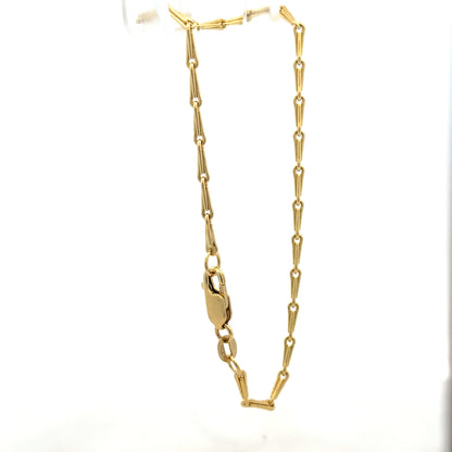 9ct yellow gold bracelet weighing 3.5g with a simple, elegant design, unbranded, showcasing its polished finish and fine craftsmanship.