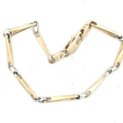 9ct yellow gold bracelet weighing 8.9g, unbranded, featuring a sleek chain design, displayed on a neutral background.