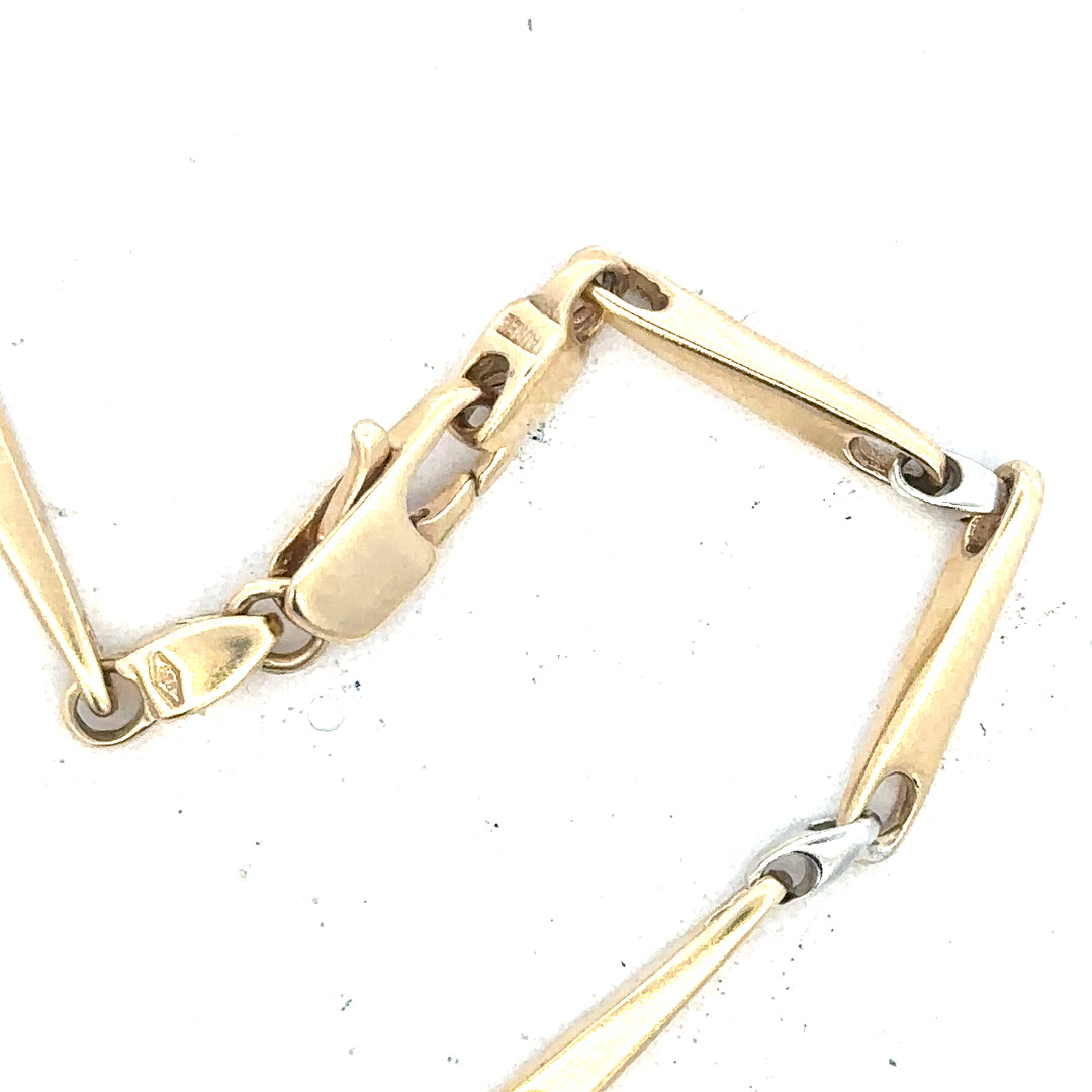 9ct yellow gold bracelet weighing 8.9g, unbranded, with a sleek design, shown in a close-up image highlighting its polished finish.