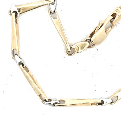 9ct yellow gold bracelet weighing 8.9g, unbranded, featuring a sleek and elegant design, shown on a plain background.