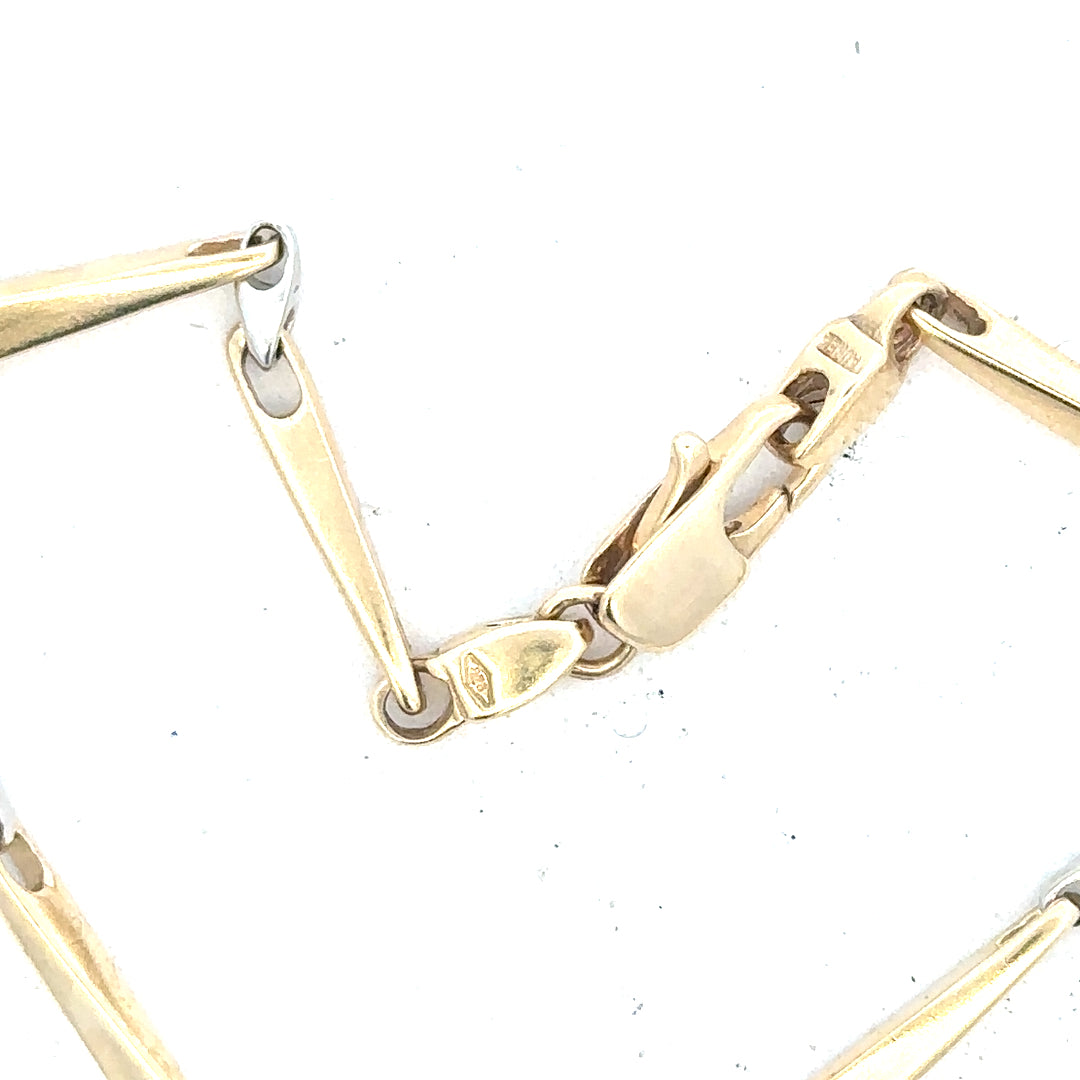 9ct yellow gold bracelet with a delicate chain design, weighing 8.9 grams, unbranded jewelry accessory.