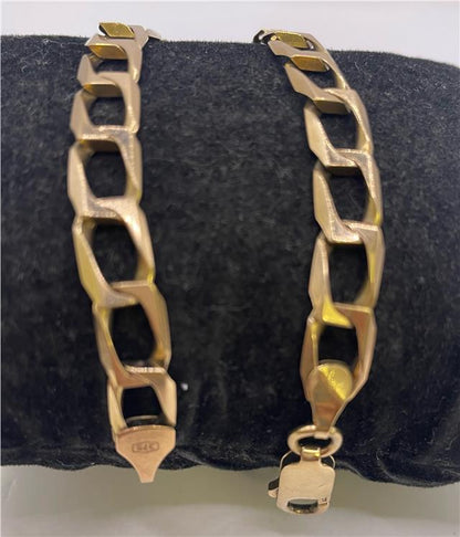 9ct yellow gold bracelet with intricate link design, showcasing a delicate and elegant jewelry piece.