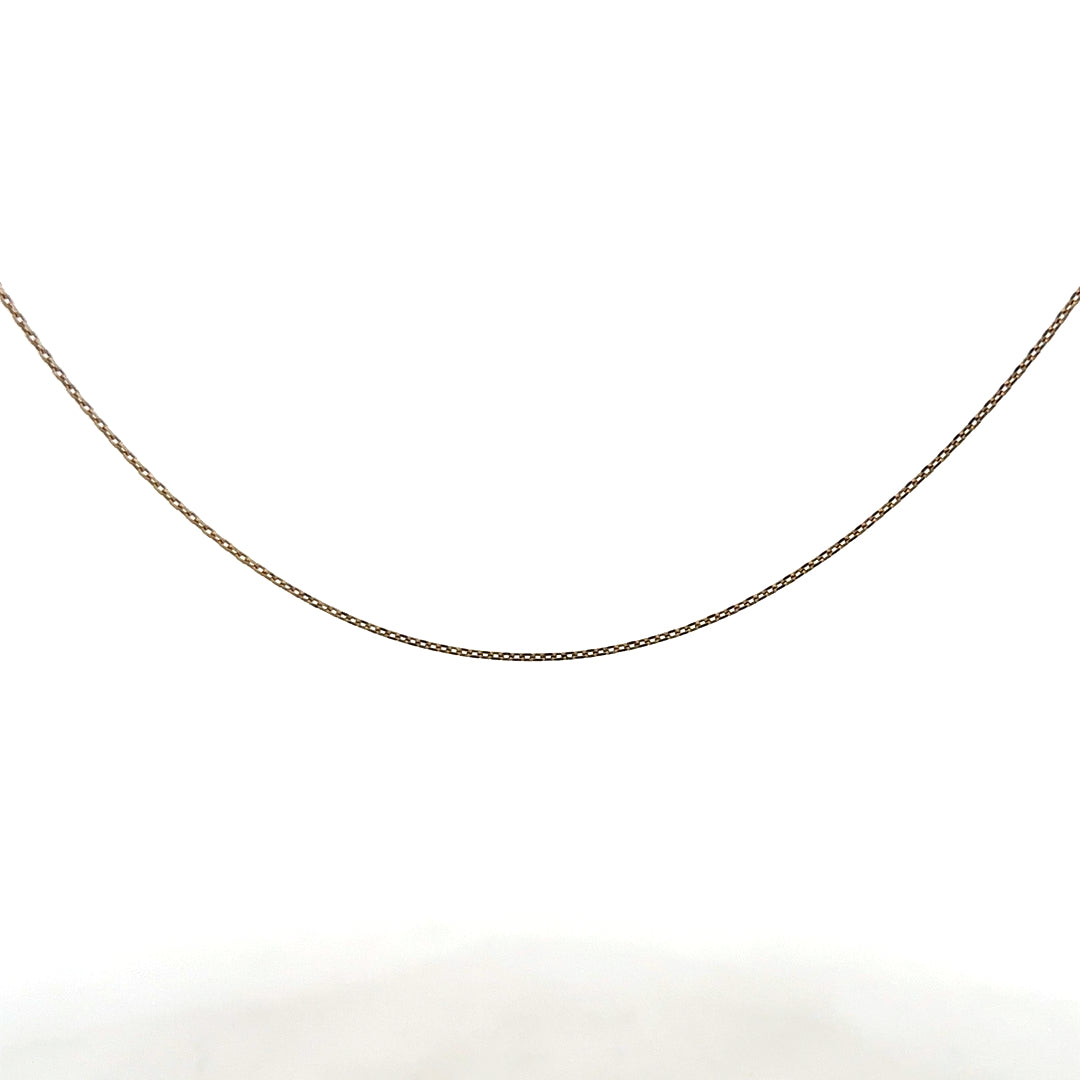 9ct yellow gold chain weighing 1.3g, unbranded, with a detailed close-up showing its fine link design and polished finish.