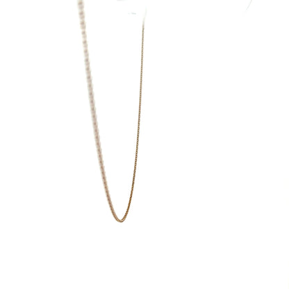 9ct yellow gold chain weighing 1.3g, unbranded, with a detailed close-up of the chain's links and shine.