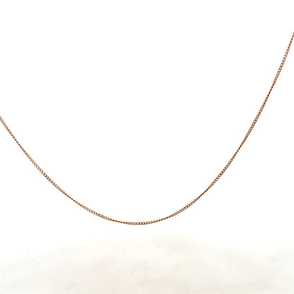 9ct yellow gold chain weighing 1.4g, unbranded, with a classic link design, shown in a close-up image on a plain background.