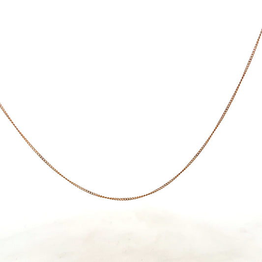 9ct yellow gold chain weighing 1.4g, unbranded, with a classic link design, shown in a close-up image on a plain background.