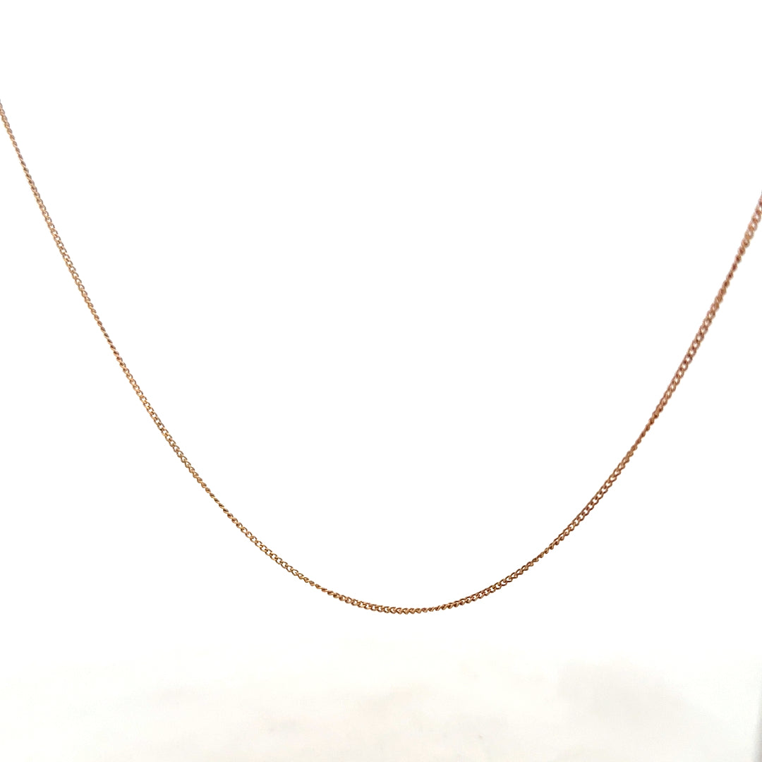 9ct yellow gold chain weighing 1.4g, unbranded jewelry with a delicate design, shown in the product image.