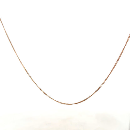 9ct yellow gold chain weighing 1.4g, unbranded jewelry with a delicate design, shown in the product image.