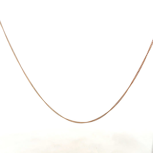 9ct yellow gold chain weighing 1.4g, unbranded jewelry with a delicate design, shown in the product image.