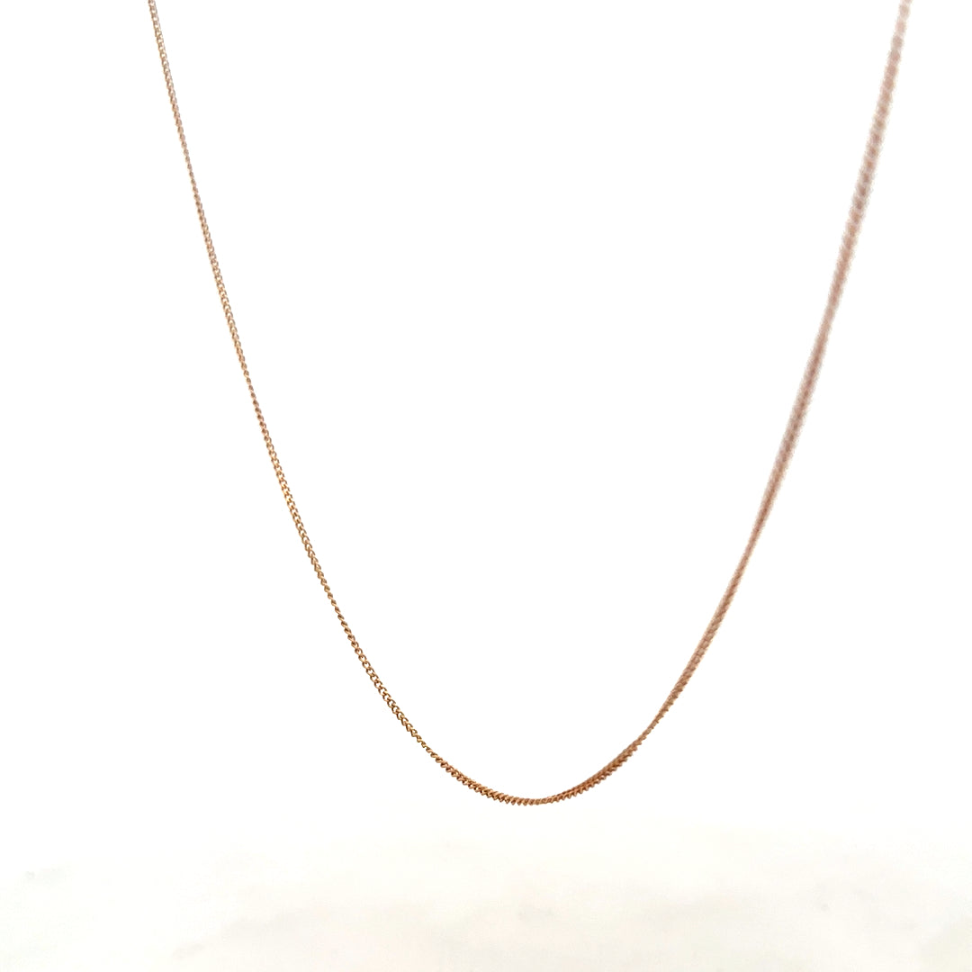 9ct yellow gold chain weighing 1.4g, unbranded, with a delicate link design visible in the image.