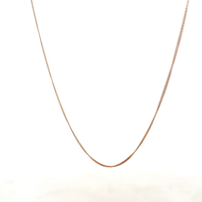 9ct yellow gold chain weighing 1.4g, unbranded, with a delicate link design visible in the image.