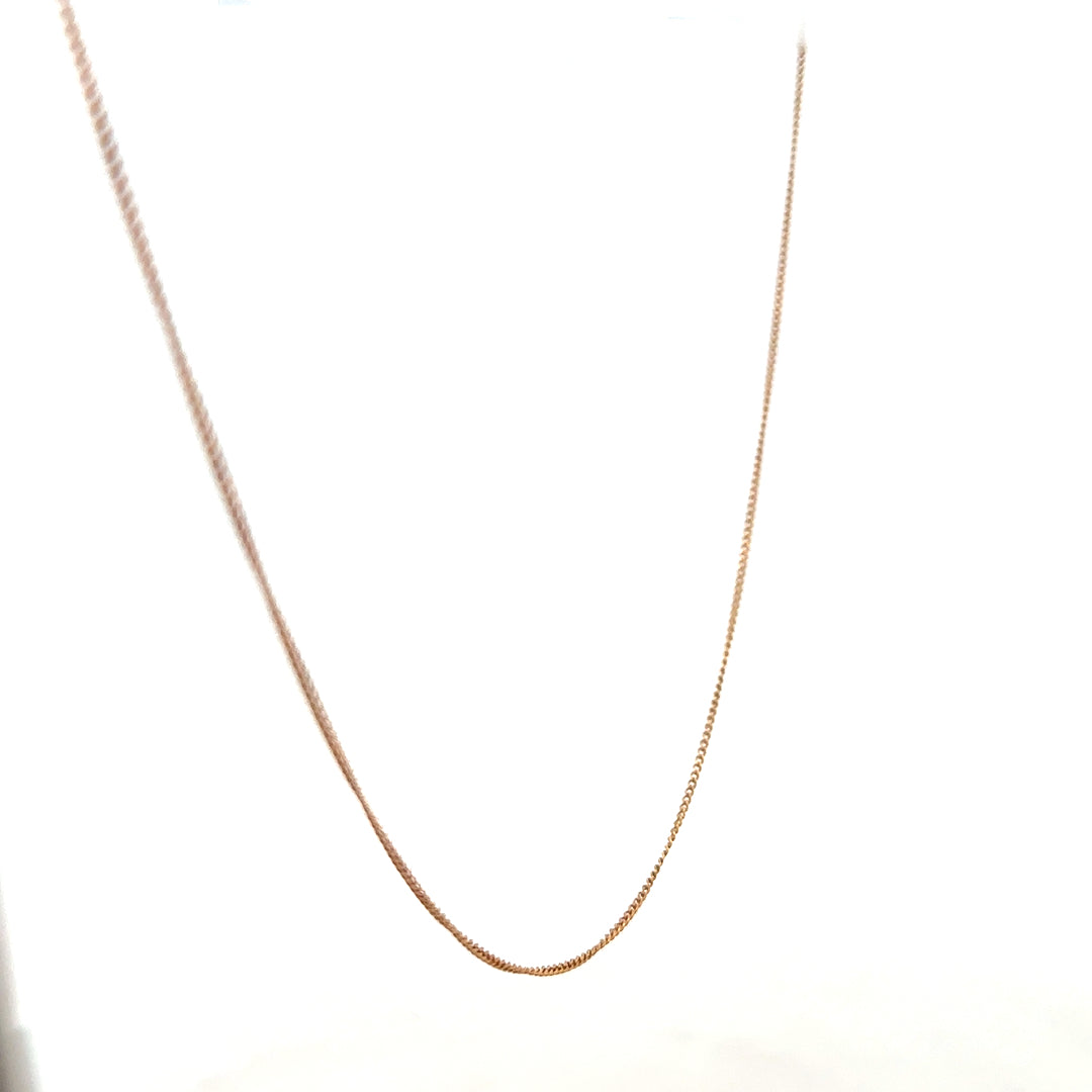 9ct yellow gold chain weighing 1.4g, unbranded jewelry accessory with a classic link design, displayed on a plain background