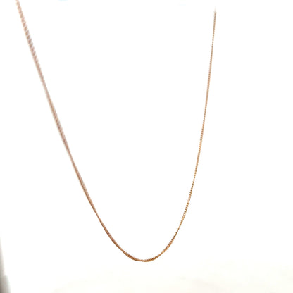 9ct yellow gold chain weighing 1.4g, unbranded jewelry accessory with a classic link design, displayed on a plain background