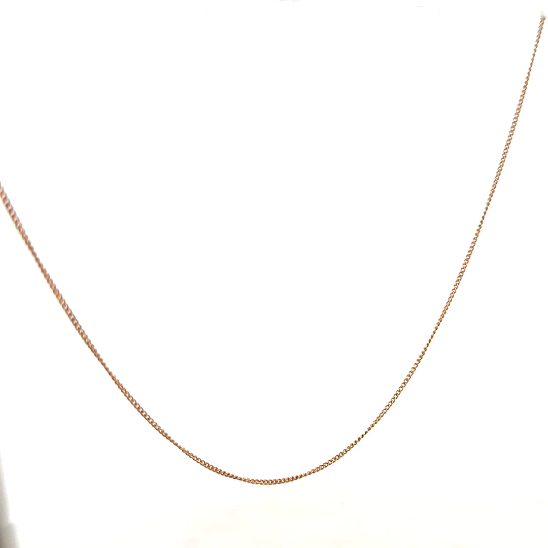 9ct yellow gold chain weighing 1.4g, unbranded jewelry chain with a classic design, shown in a close-up image.
