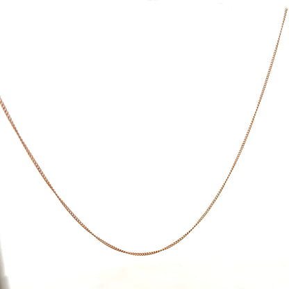 9ct yellow gold chain weighing 1.4g, unbranded jewelry chain with a classic design, shown in a close-up image.