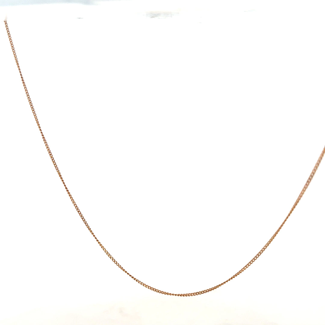 9ct yellow gold chain weighing 1.4g, unbranded jewelry piece with a classic chain design, shown in close-up.