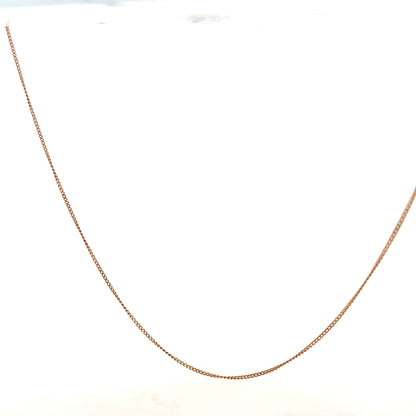 9ct yellow gold chain weighing 1.4g, unbranded jewelry piece with a classic chain design, shown in close-up.