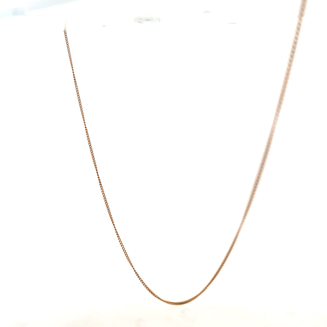 9ct yellow gold chain weighing 1.4g, unbranded, showing a close-up of the sleek, polished jewelry chain on a white background.