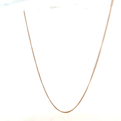 9ct yellow gold chain weighing 1.4g, unbranded, showing a close-up of the sleek, polished jewelry chain on a white background.