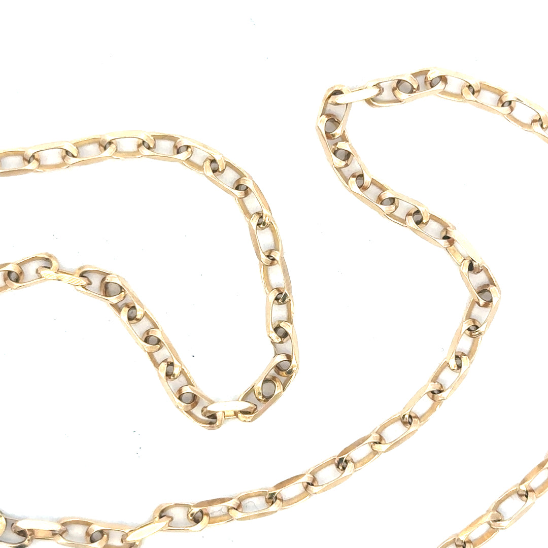 9ct yellow gold chain weighing 10.9g, unbranded jewelry piece with a classic linked design, displayed against a neutral background.