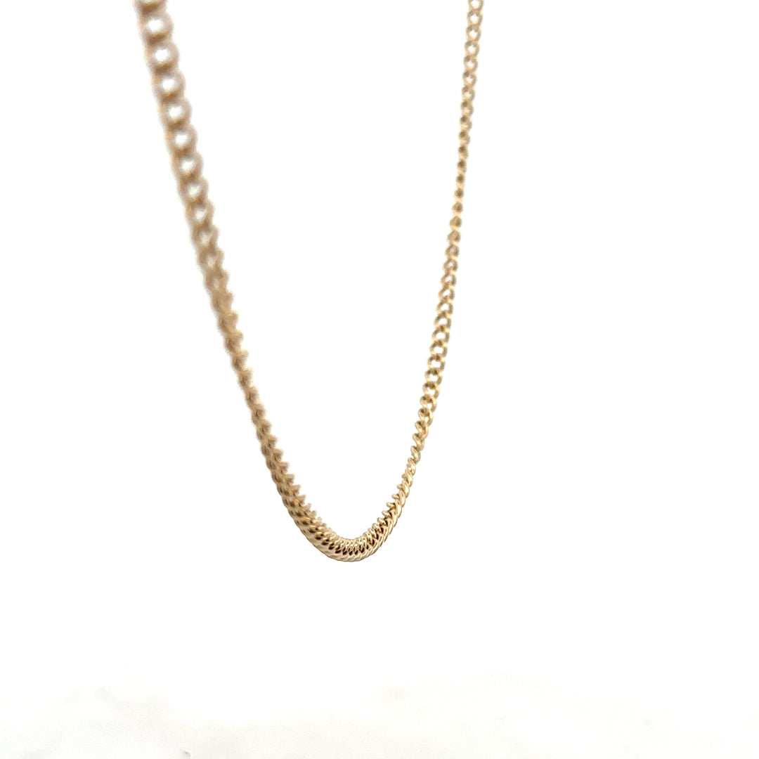 9ct yellow gold chain weighing 10.9g, unbranded, with a detailed close-up of the chain links on a plain background.