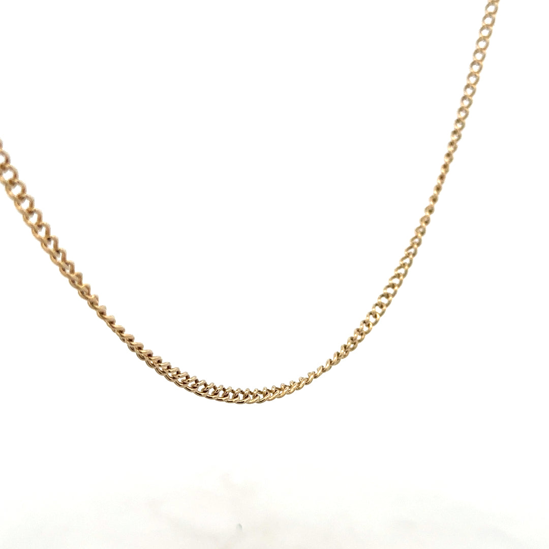 9ct yellow gold chain weighing 10.9g, unbranded jewelry piece with a classic design, shown on a plain background.