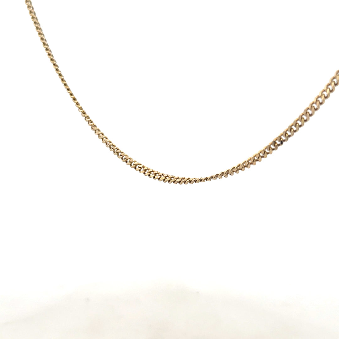 9ct yellow gold chain weighing 11g, unbranded, with a classic link design, shown in a close-up view of the jewelry.