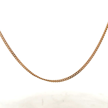 9ct yellow gold chain weighing 12.7g, unbranded, with a detailed close-up of the elegant jewelry chain.