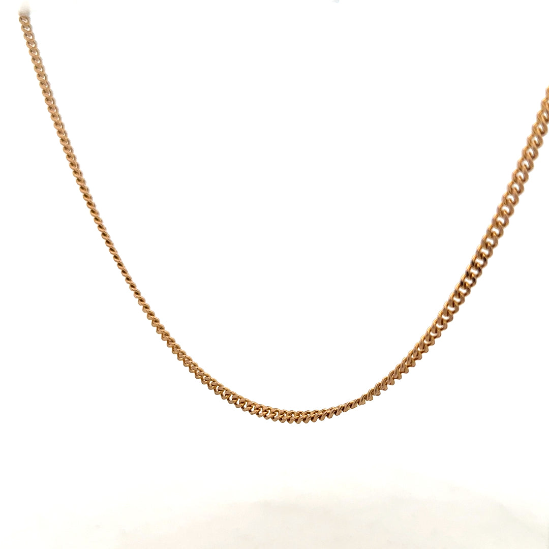 9ct yellow gold chain weighing 12.7g, unbranded jewelry chain with a classic design, detailed close-up of the gold link structure.