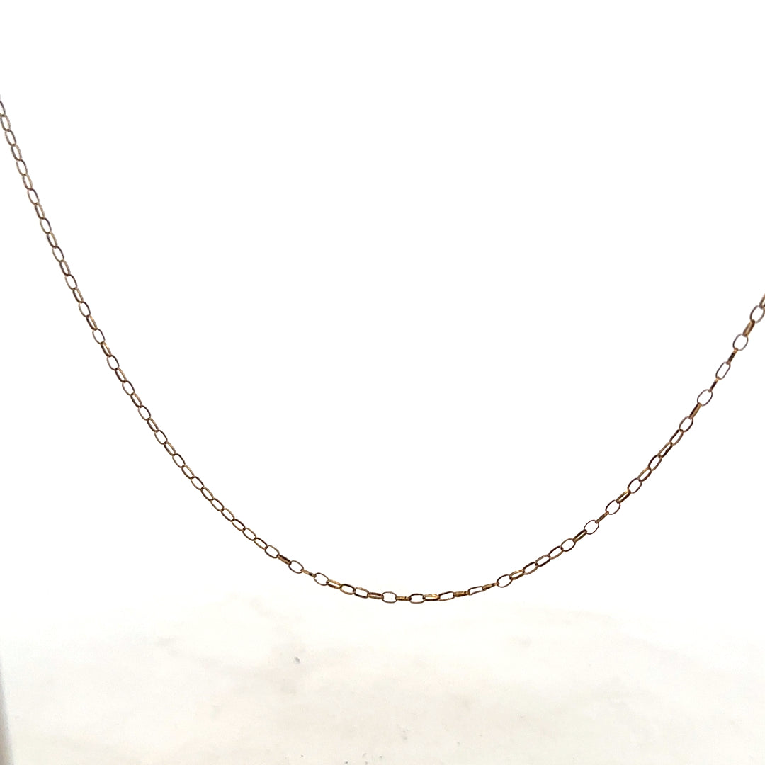 9ct yellow gold chain with a 1g weight, showcasing a delicate and polished jewelry chain with a secure clasp.