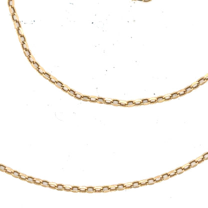9ct yellow gold chain weighing 2.4g, featuring a classic design, with a close-up view of its polished links.