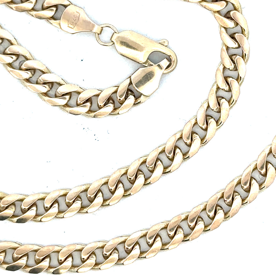 9ct yellow gold chain weighing 22.7g, unbranded, with a detailed close-up of the gold chain's links and shine