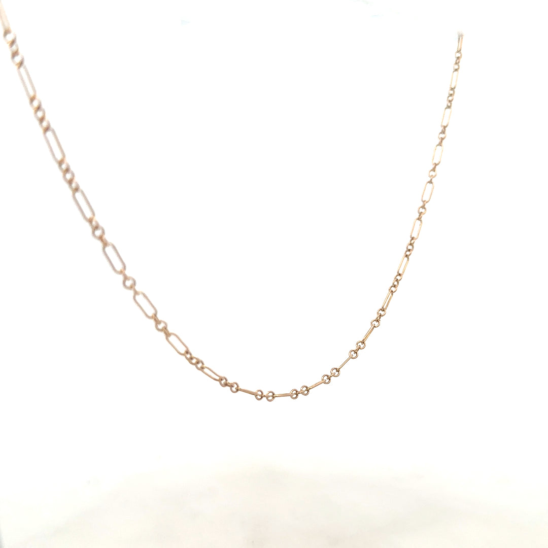 9ct yellow gold chain weighing 3.3g, unbranded, with a close-up view showing its fine links and polished finish.