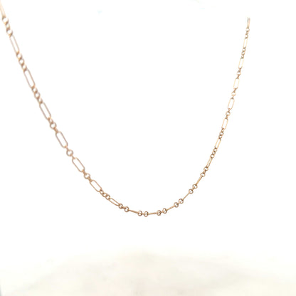 9ct yellow gold chain weighing 3.3g, unbranded, with a close-up view showing its fine links and polished finish.