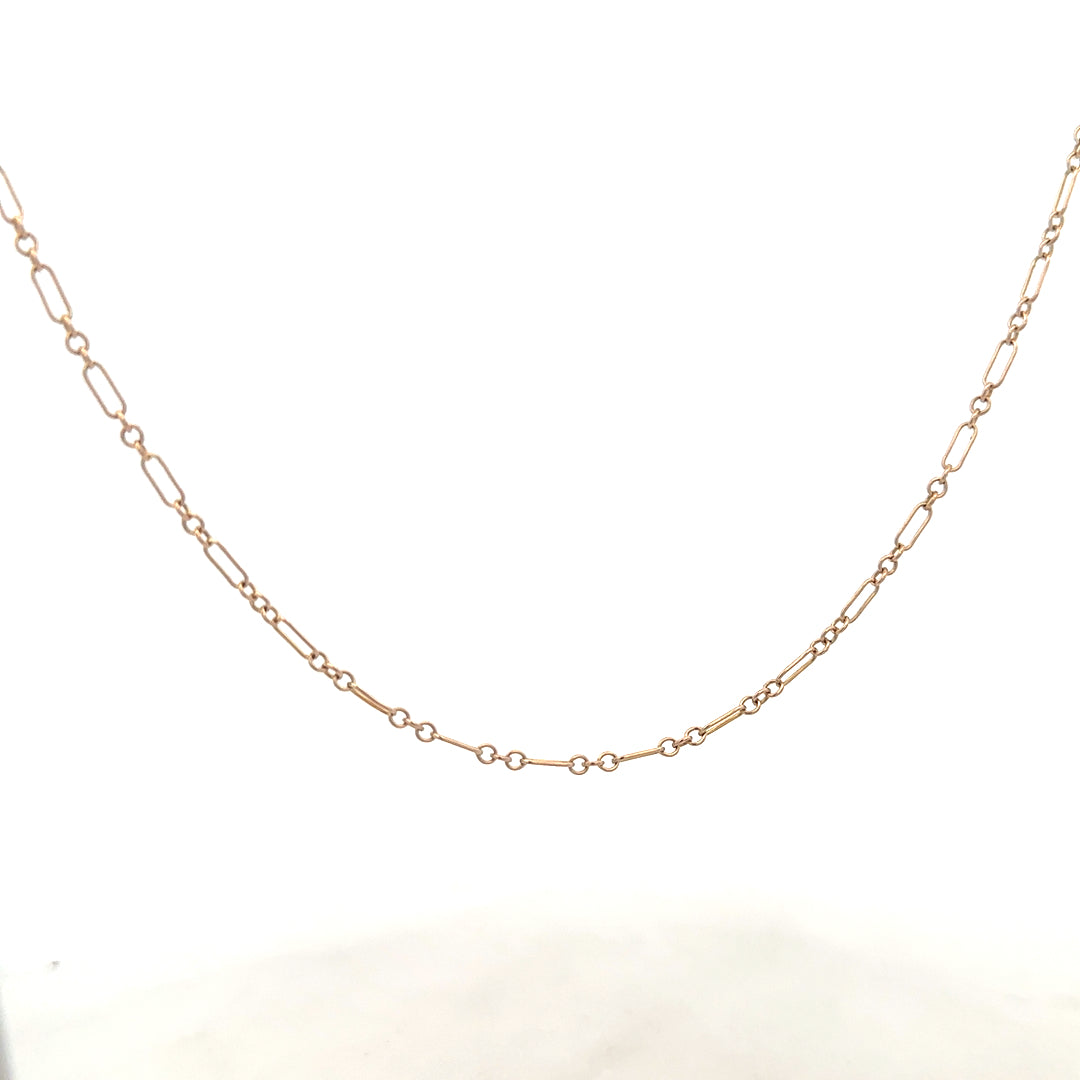 9ct yellow gold chain weighing 3.3g, unbranded jewelry chain with detailed link design, shown in a close-up image.