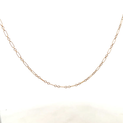 9ct yellow gold chain weighing 3.3g, unbranded jewelry chain with detailed link design, shown in a close-up image.