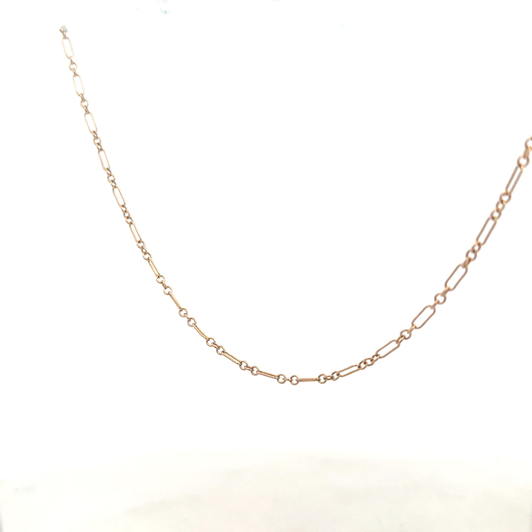 9ct yellow gold chain weighing 3.3g, unbranded, with a detailed close-up showing its polished links and craftsmanship.
