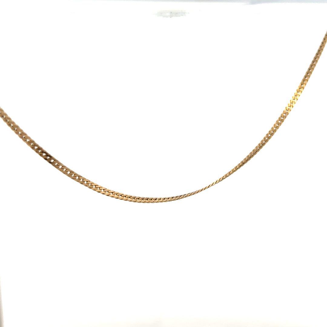 9ct yellow gold chain weighing 4.6g, unbranded, featuring a detailed link design, displayed on a neutral background.