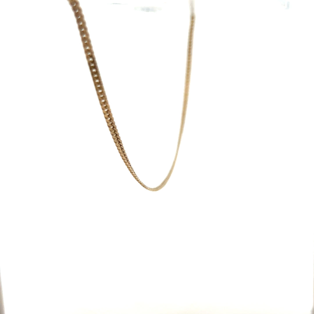 9ct yellow gold chain weighing 4.6g, unbranded jewelry chain with a classic design, shown in close-up detail.