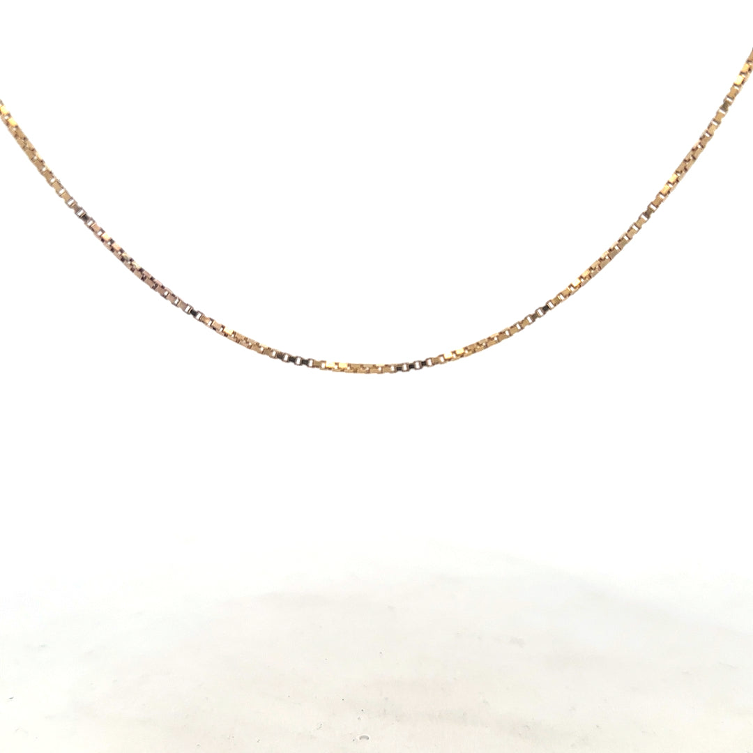 9ct yellow gold chain weighing 6.1g, unbranded jewelry piece with a detailed chain link design, shown in a close-up image.