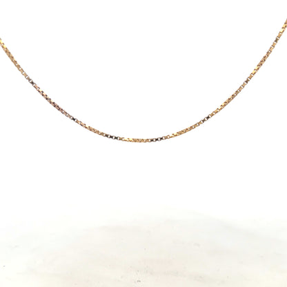 9ct yellow gold chain weighing 6.1g, unbranded jewelry piece with a detailed chain link design, shown in a close-up image.