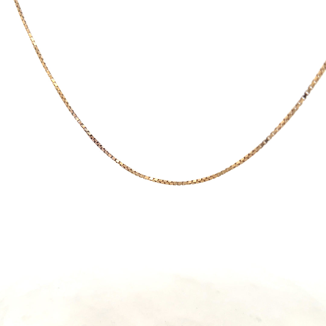 9ct yellow gold chain weighing 6.1g, unbranded, with a classic link design, shown in a close-up on a plain background.